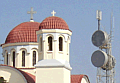 Kirche und Mobilfunkmast in der Innenstadt von Retimnon